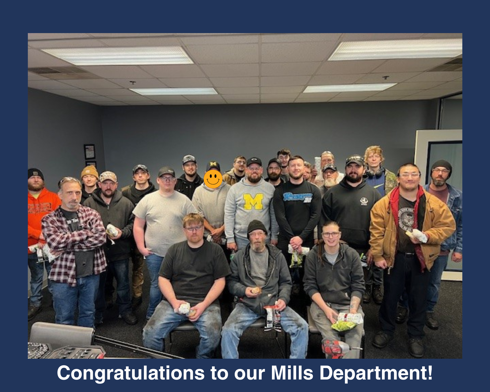 Group photo of people standing and smiling